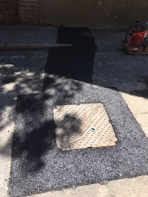 Manhole Cover with New Tarmac