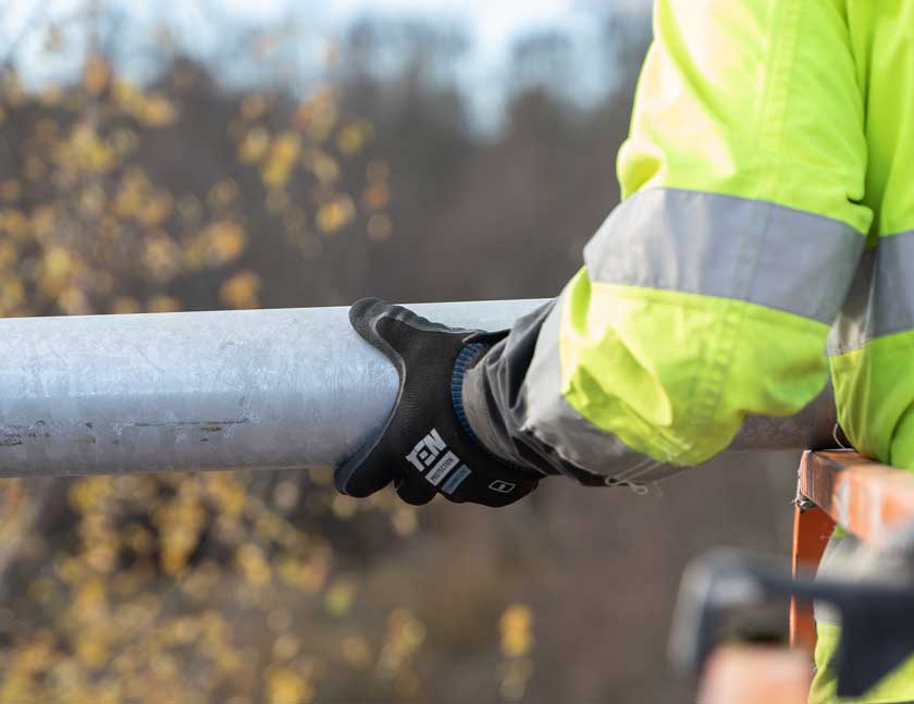 Contractor Carrying Pipe